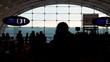 silhouettes of people in boarding room at against oval window silhouettes of people in boarding room at against oval window