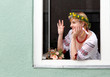 Portrait Happy Ukrainian woman in the window