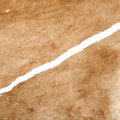 Photo: Aged leather texture with a large crack in it Aged leather texture with a large crack in it