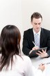 Photo: a young businessman talking to women a young businessman talking to women
