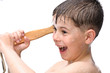 A boy swims in the bathtub