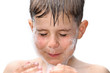 A boy swims in the bathtub