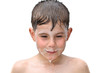 A boy swims in the bathtub