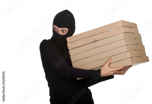 Photo: female thief in balaclava with boxes of pizza. female thief in balaclava with boxes of pizza.