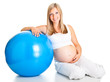 Pregnant woman excercises with gymnastic ball