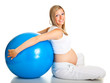 Pregnant woman excercises with gymnastic ball