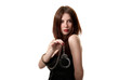 Young saxy brunette in handcuffs