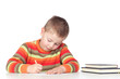 Adorable boy studying