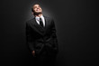 Young African-American businessman in black suit.