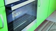 Putting croissant into oven