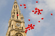 Many red balloons in front of the town hall in Vienna, Austria