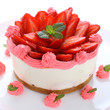 Cheesecake with fresh strawberries on white background