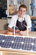 Foto: Student learning about wind power and solar panels in vocational school Student learning about wind power and solar panels in vocational school