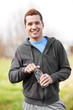 Photo: Mixed race man holding water bottle Mixed race man holding water bottle