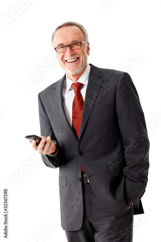 Foto: Smiling mature business man with mobilephone Smiling mature business man with mobilephone