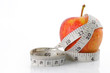 fresh red apples with measured tape