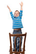 Little boy raises his arms up