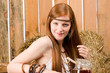 Red-hair hippie woman have breakfast in barn Red-hair hippie woman have breakfast in barn
