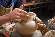 hands of a potter, creating an earthen jar on the circle hands of a potter, creating an earthen jar on the circle