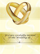 A wedding invitation card with gold rings
