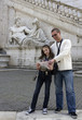 Young girl and her father studying a city map