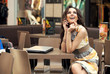 Young smiling businesswoman talking on the phone