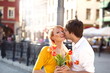 Handsome man kissing beautiful girl