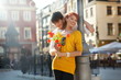 Young couple with flowers, outdoors Young couple with flowers, outdoors