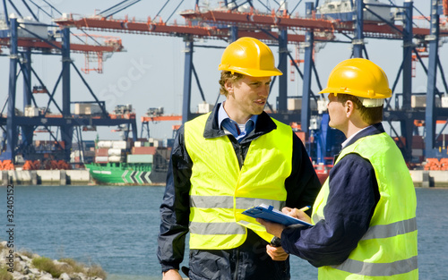 Photo: Dockers in a container harbor Dockers in a container harbor