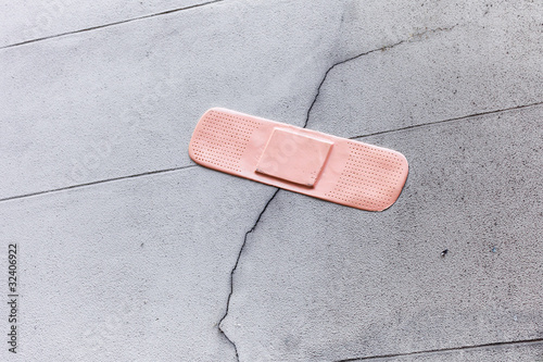 Photo: Plaster on a broken wall, symbolic Plaster on a broken wall, symbolic
