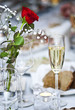 Flowers and glass of champagne