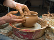 hands of a potter, creating an earthen jar on the circle hands of a potter, creating an earthen jar on the circle
