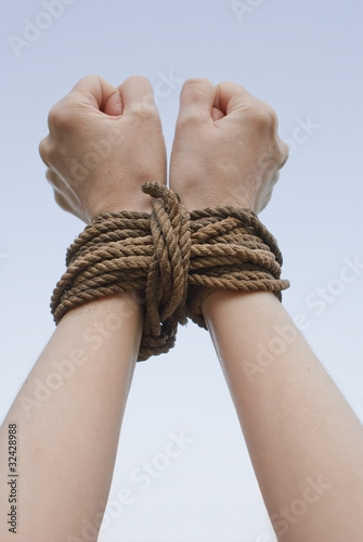 Photo: Tied with rope hands Tied with rope hands