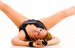 Young attractive Caucasian fitness woman doing gymnastics