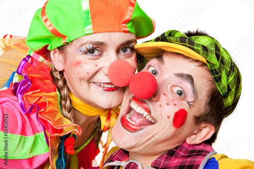 Photo: Two clown smiling isolated over a white background Two clown smiling isolated over a white background