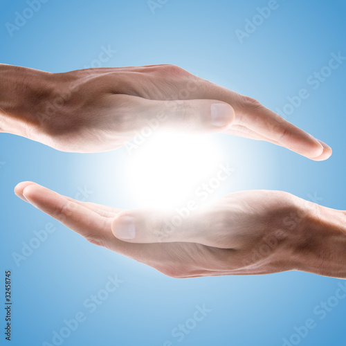 Photo: hands holding sun hands holding sun