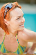 Smiling woman in bikini in pool