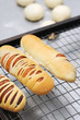 Fresh bread cake on cooler rack isolated ball dough