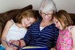 Grandma Reading a Story to her Grandchildren
