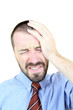 Headache - young businessman in pain
