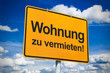 Ortsschild mit Wohnung zu vermieten