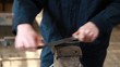 Hands of manual worker  grinding metal in metal industry