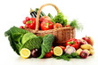 Raw vegetables and wicker basket isolated on white Raw vegetables and wicker basket isolated on white