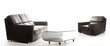 A view of a room with black leather sofa
