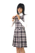 Young asian girl is playing on a flute