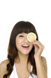 Crazy woman with one piece of lime on her eyes isolated