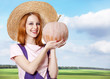 Young girl in overalls with pumpkin. Young girl in overalls with pumpkin.