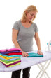 housewife folding clothes over white background