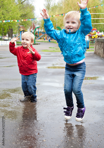 Photo: Boy with girl are walking on the street Boy with girl are walking on the street