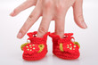 crocheted booties for a girl in the woman hand crocheted booties for a girl in the woman hand